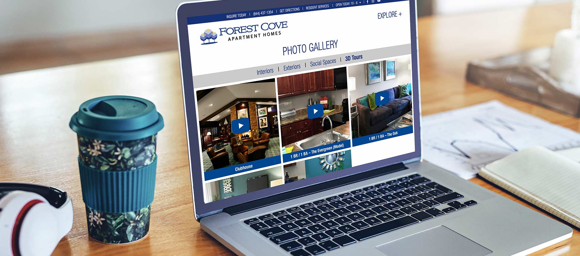 Laptop displaying Forest Cover Apartments Website 3D tour options in the Photo Gallery section