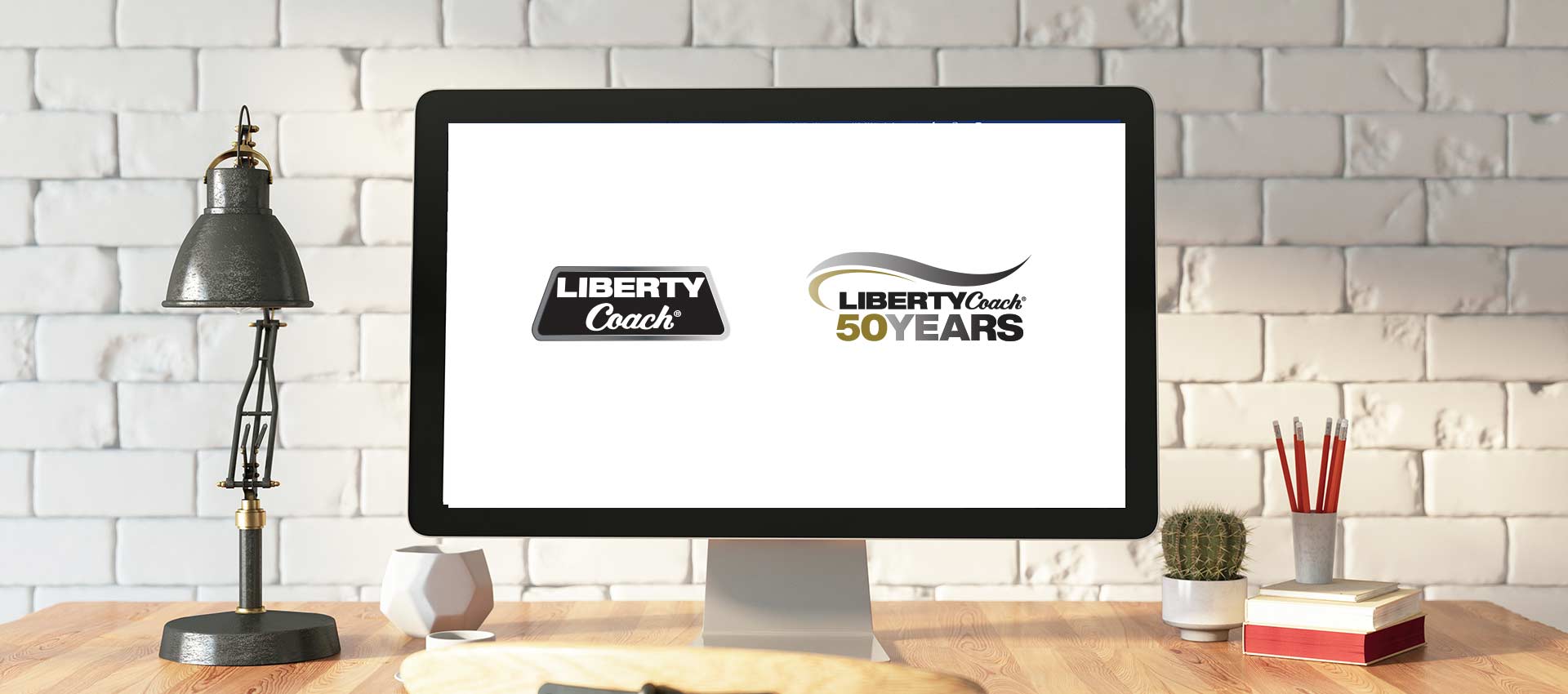 Front view of computer displaying Liberty Coach 50 year